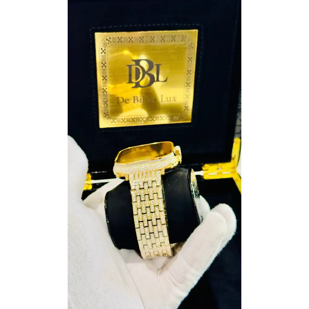 Gold-plated Apple Watch Ultra with inlaid zircon case accents and a rhinestone link band; customization design reference.