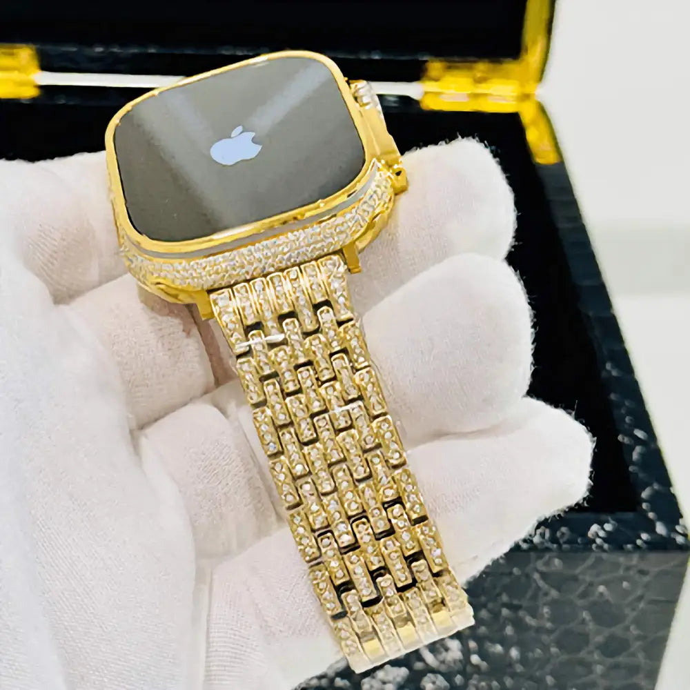 Gold-plated Apple Watch Ultra with inlaid zircon case accents and a rhinestone link band; customization design reference.