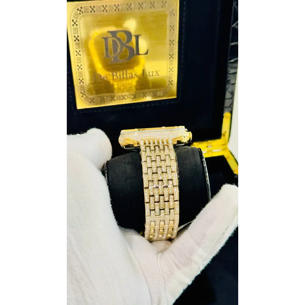 Gold-plated Apple Watch Ultra with inlaid zircon case accents and a rhinestone link band; customization design reference.