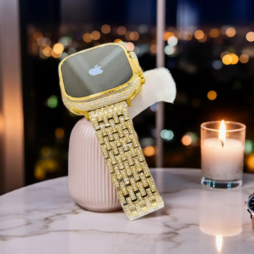 Gold-plated Apple Watch Ultra with inlaid zircon case accents and a rhinestone link band; customization design reference.