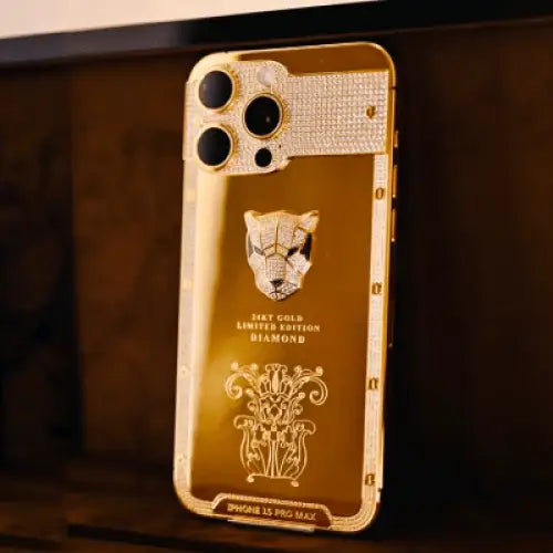 Gold-finish phone with panther emblem and engraved back, upright view
