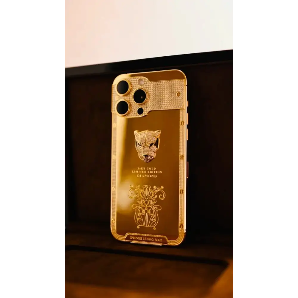 Angled view of the gold-finish phone with panther emblem