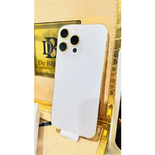 White-backed phone with gold-finish frame in front of a presentation box