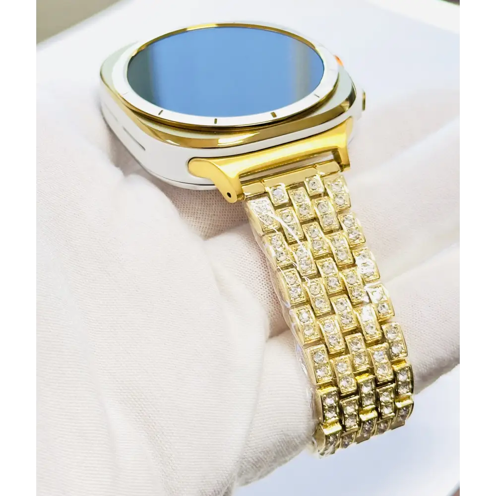 Custom Samsung Galaxy Watch Ultra 47mm with a golden-anodized case and 24K gold-plated rhinestone band