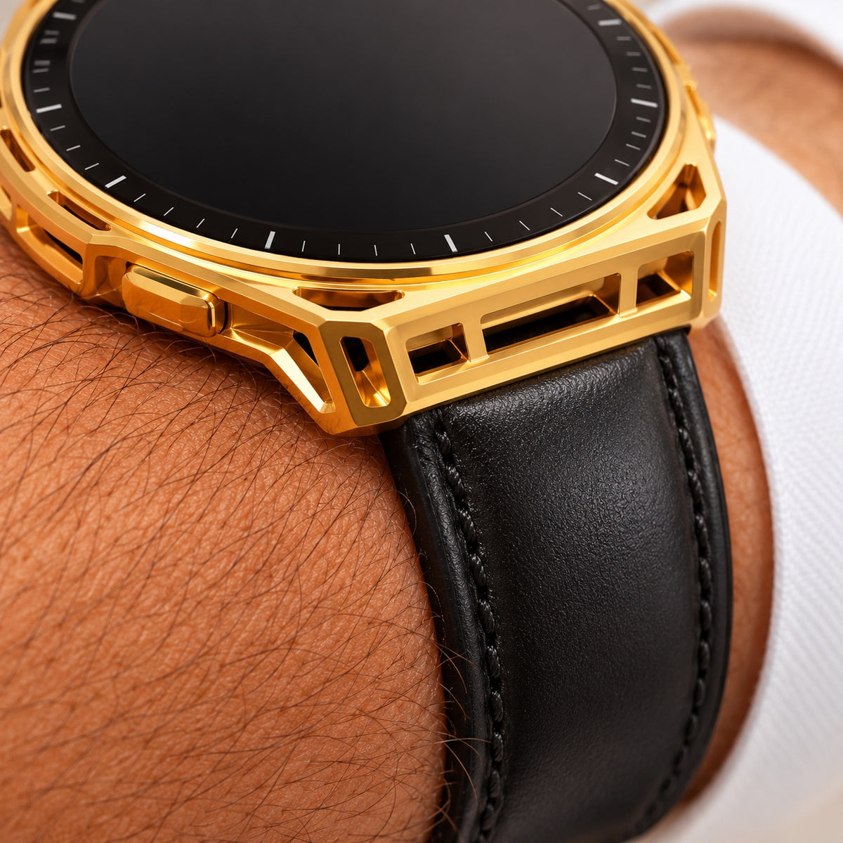 Close-up of polished gold openwork case and black stitched leather band