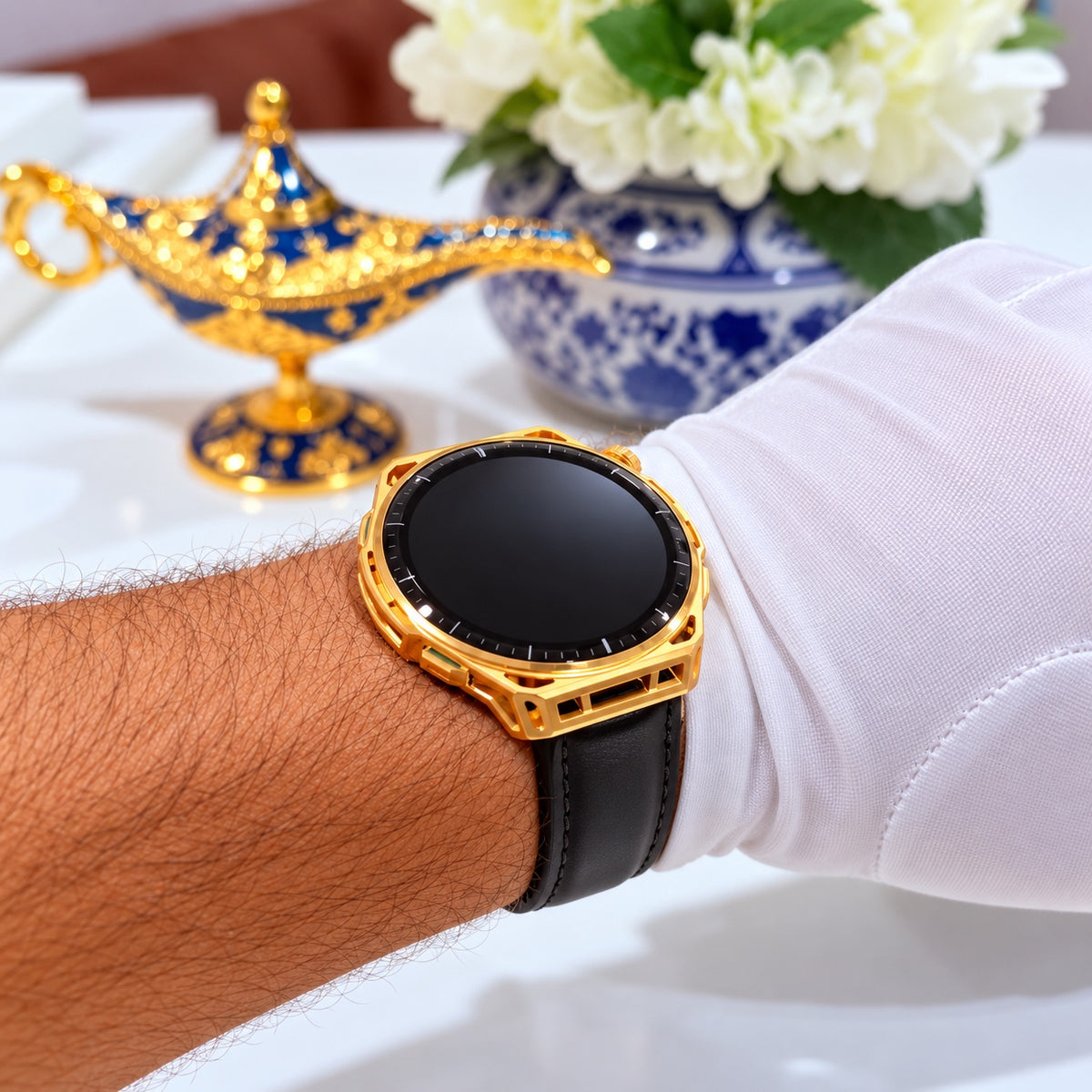 Gold plated Amazfit Balance 3 with black stitched leather band shown on wrist