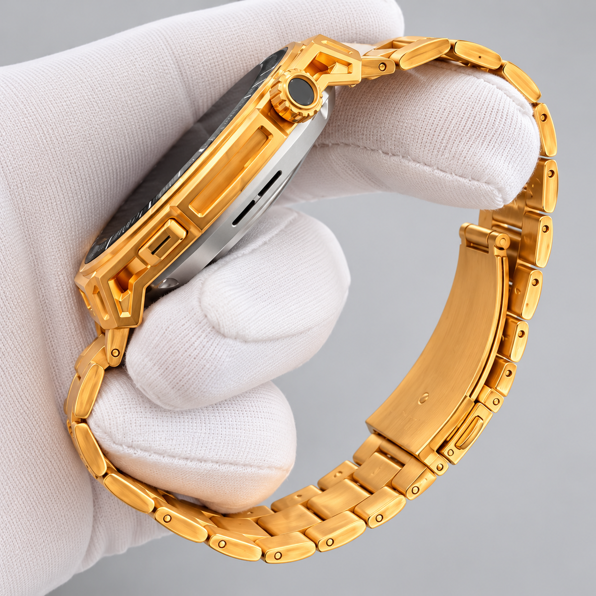 Close-up of the gold crown, case profile, link bracelet and folding clasp