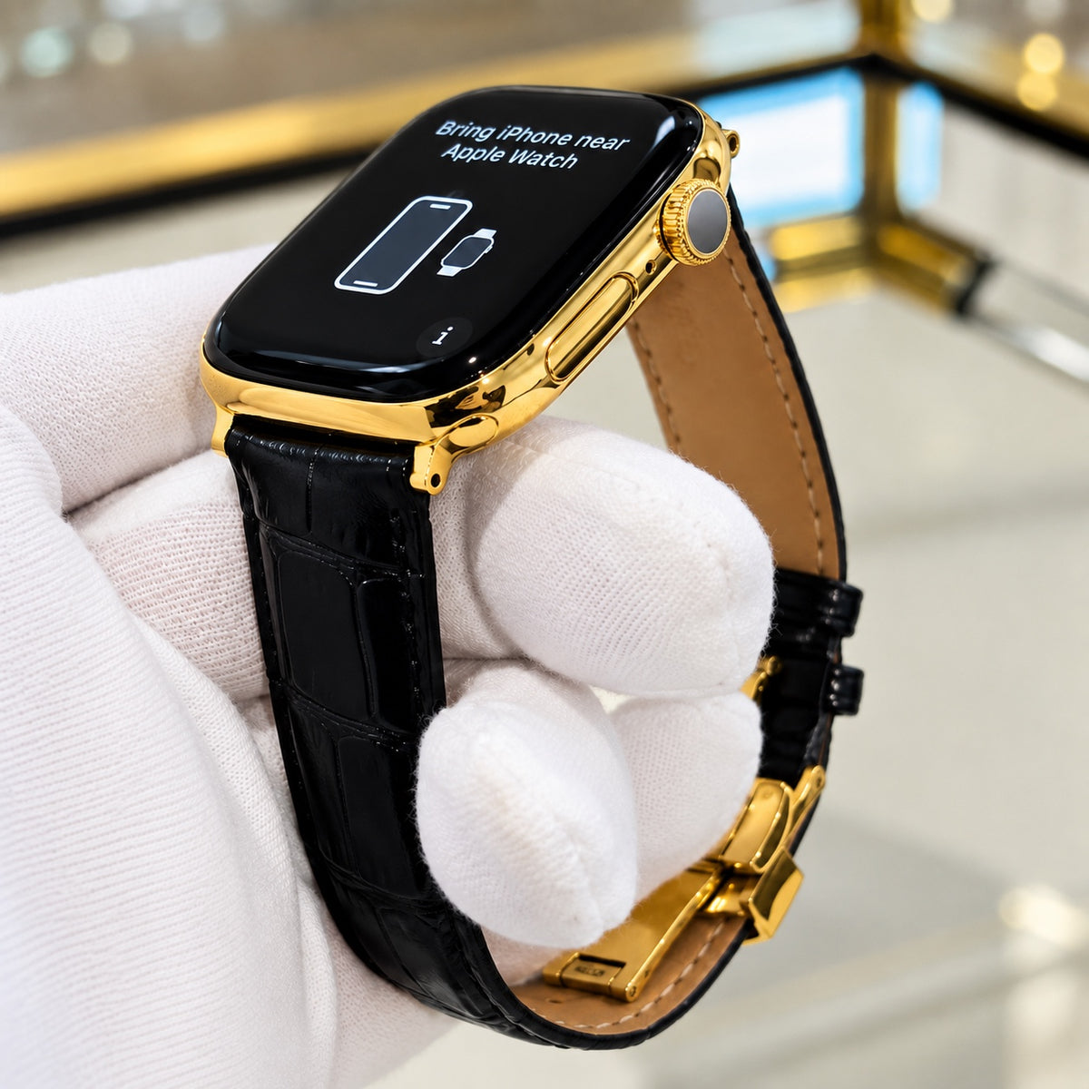 Custom 18K gold Apple Watch Series 12 crown and case detail with black alligator leather band