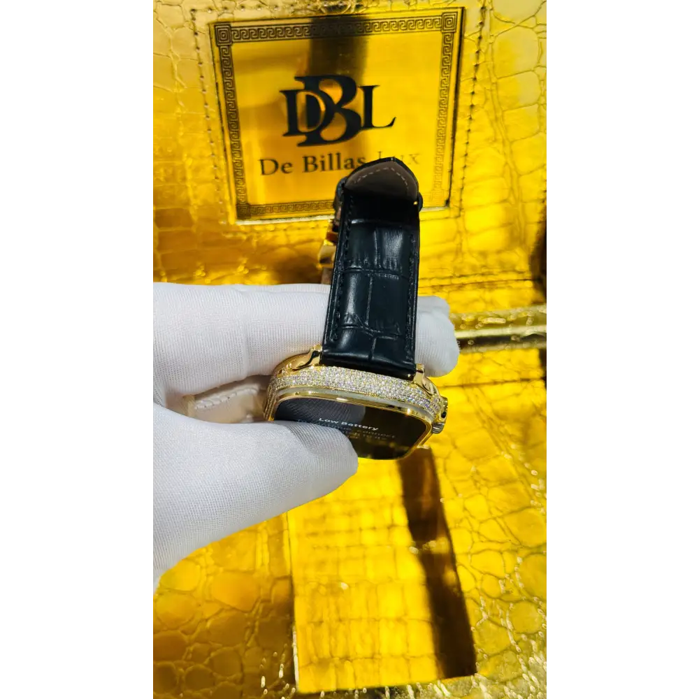 Gold-plated Apple Watch Ultra with inlaid zircon case accents and a black leather band; customization design reference.