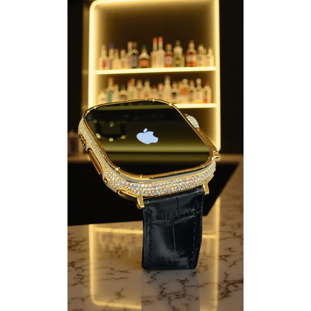 Gold-plated Apple Watch Ultra with inlaid zircon case accents and a black leather band; customization design reference.
