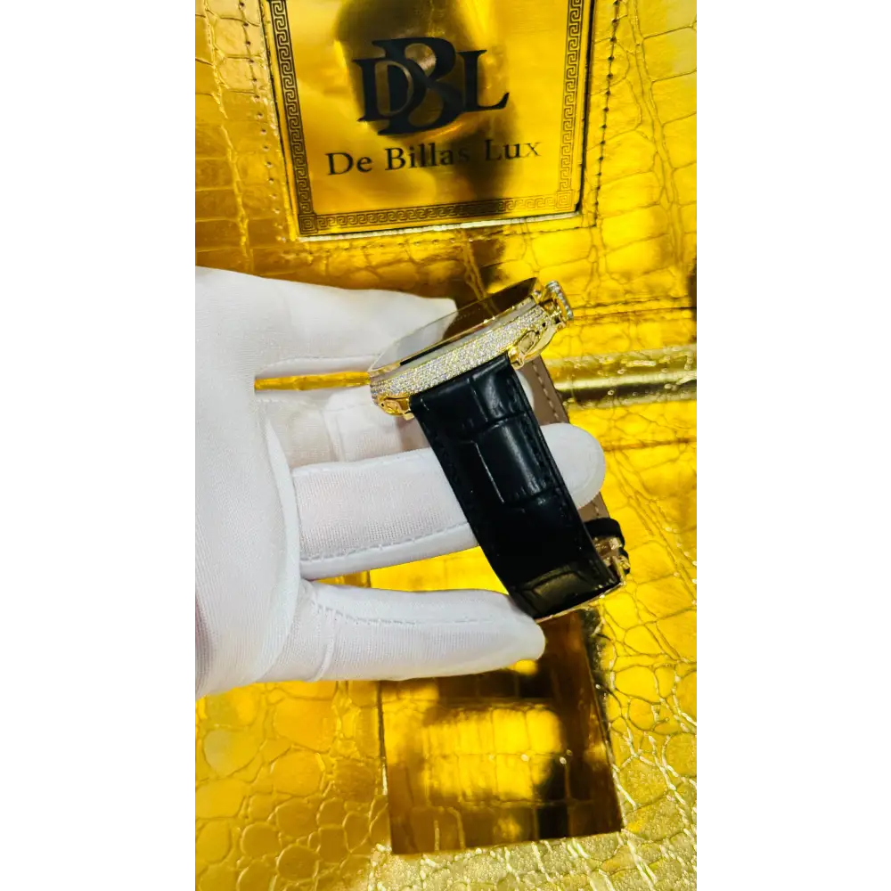 Gold-plated Apple Watch Ultra with inlaid zircon case accents and a black leather band; customization design reference.