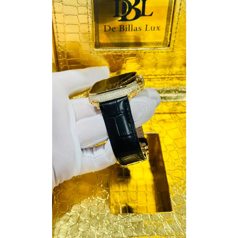 Gold-plated Apple Watch Ultra with inlaid zircon case accents and a black leather band; customization design reference.