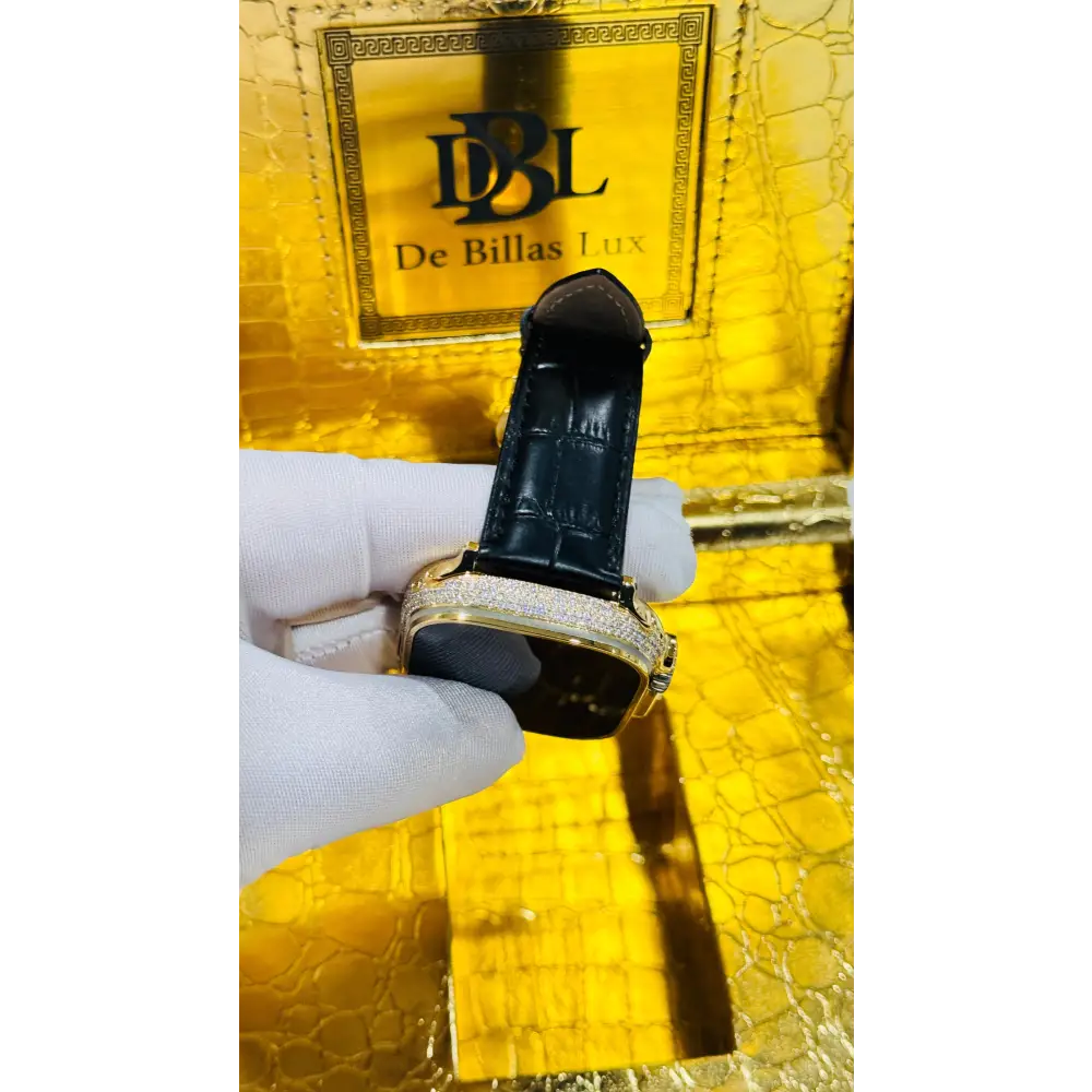 Gold-plated Apple Watch Ultra with inlaid zircon case accents and a black leather band; customization design reference.