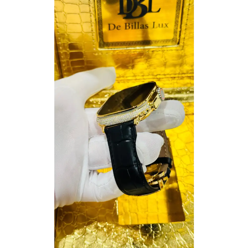 Gold-plated Apple Watch Ultra with inlaid zircon case accents and a black leather band; customization design reference.