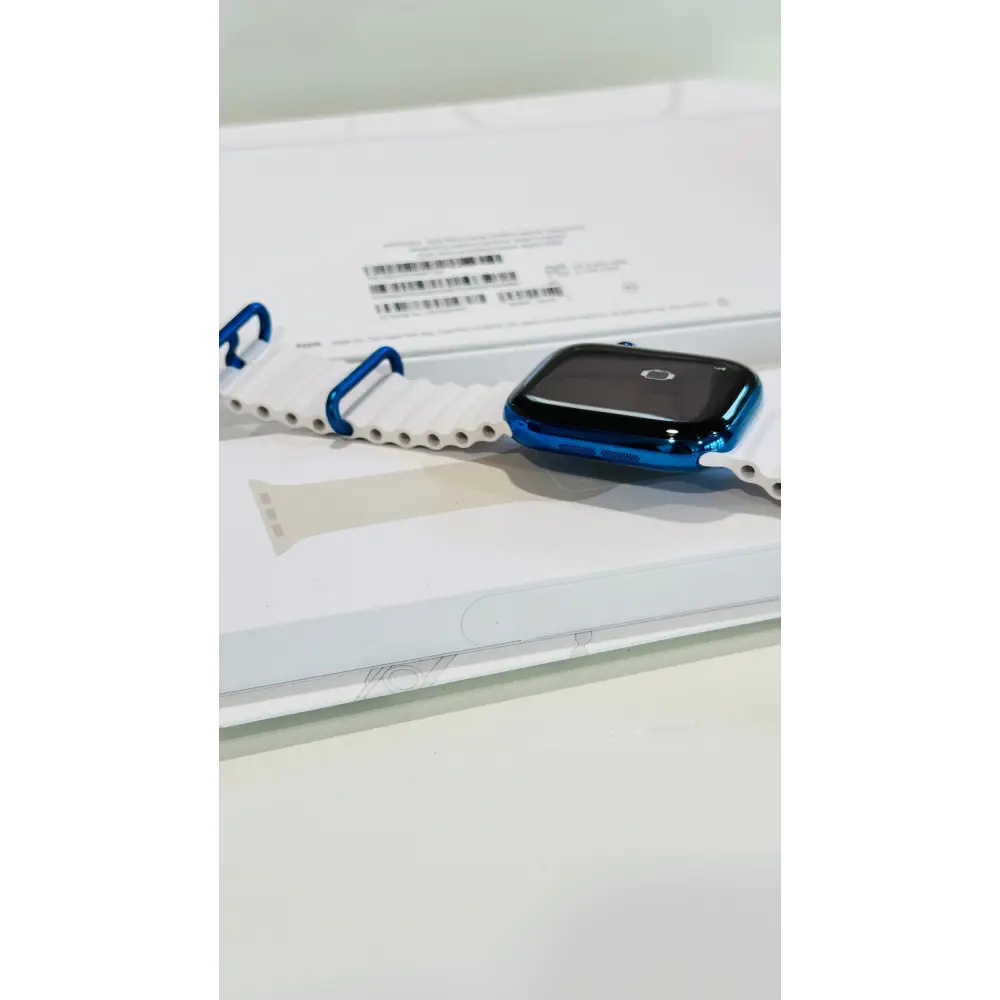 Polished blue Apple Watch with a white band; finish reference. The listing identifies the included band, case size and selected generation.