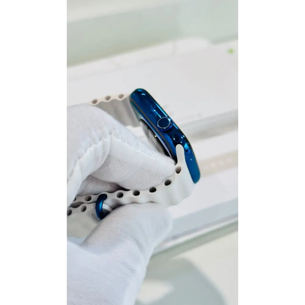 Polished blue Apple Watch with a white band; finish reference. The listing identifies the included band, case size and selected generation.