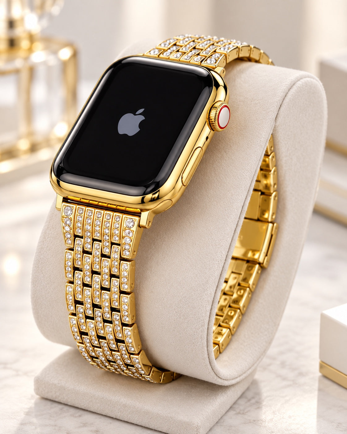 Custom 24K gold Apple Watch with rhinestone link band, angled crown-side view on an ivory cushion