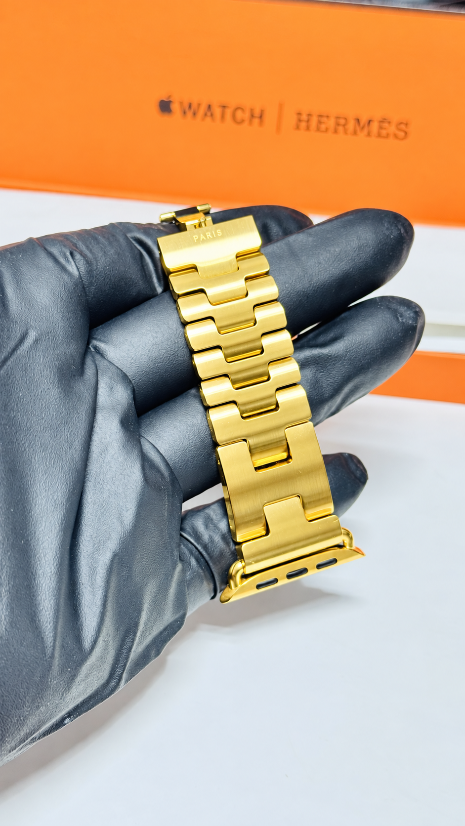Custom 24K yellow gold plated Hermès Grand H 46mm stainless steel Apple Watch band — digitally edited finish preview, H links and connector detail
