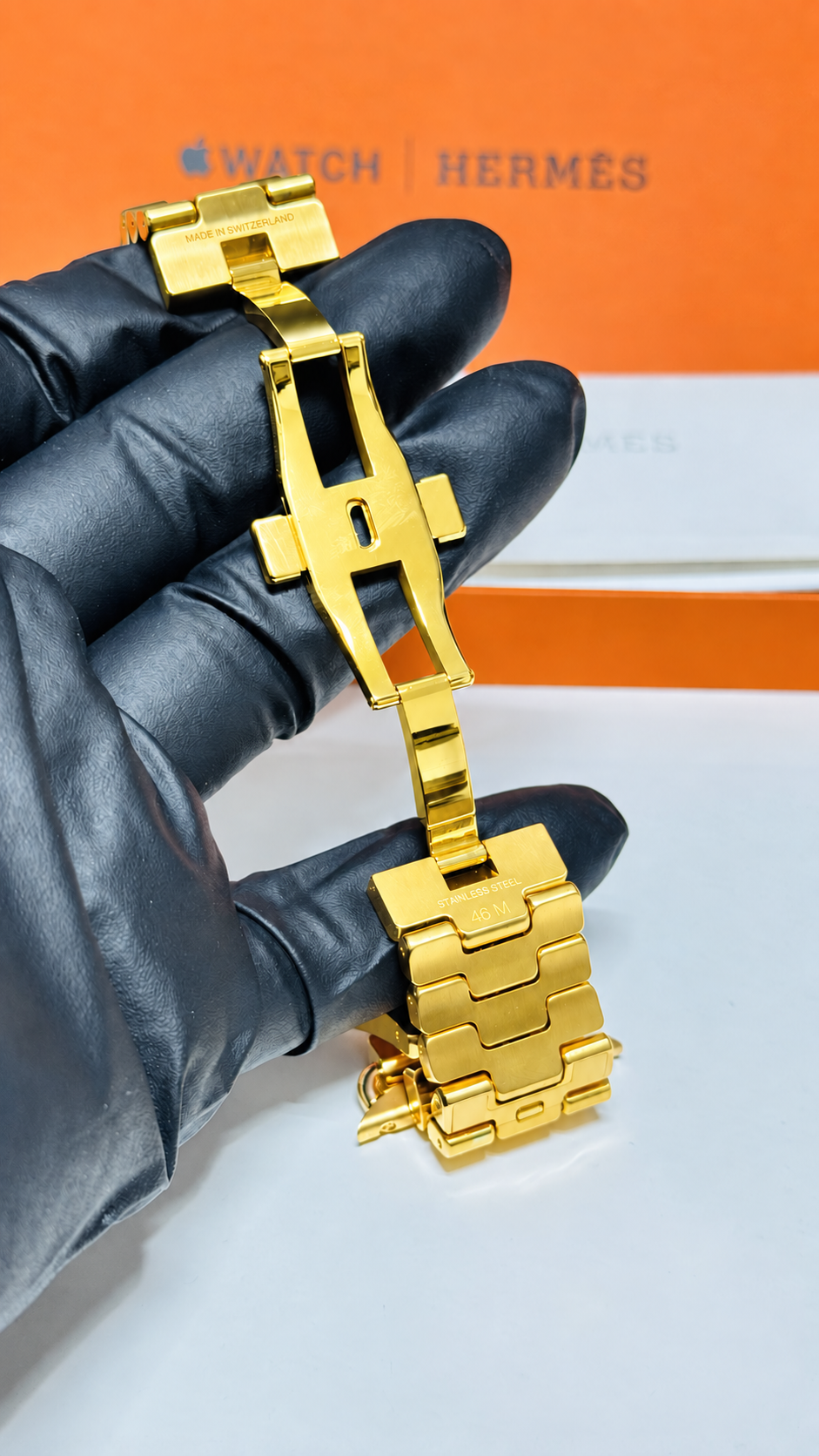 Custom 24K yellow gold plated Hermès Grand H 46mm stainless steel Apple Watch band — digitally edited finish preview, inside clasp and 46 M marking
