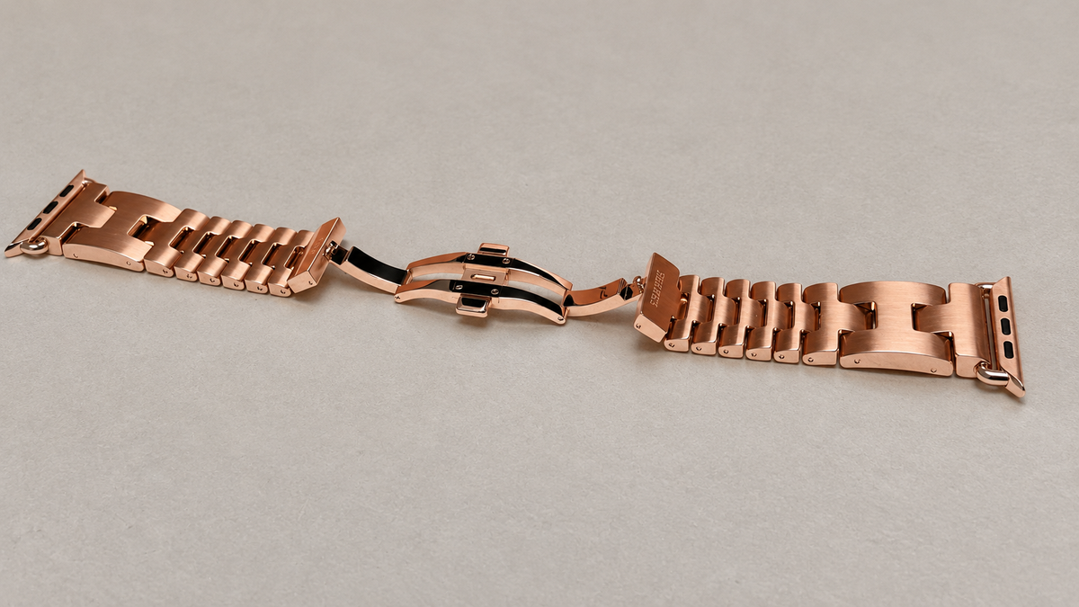 Custom rose gold plated Hermès Grand H 46mm stainless steel Apple Watch band with original open deployant clasp — generated supplemental view
