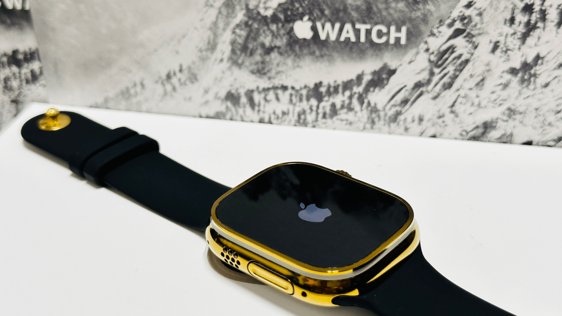 Custom diamond polished and anodized gold Apple Watch Ultra 2 49mm titanium with a Black Sport Band 24k Gold Pin