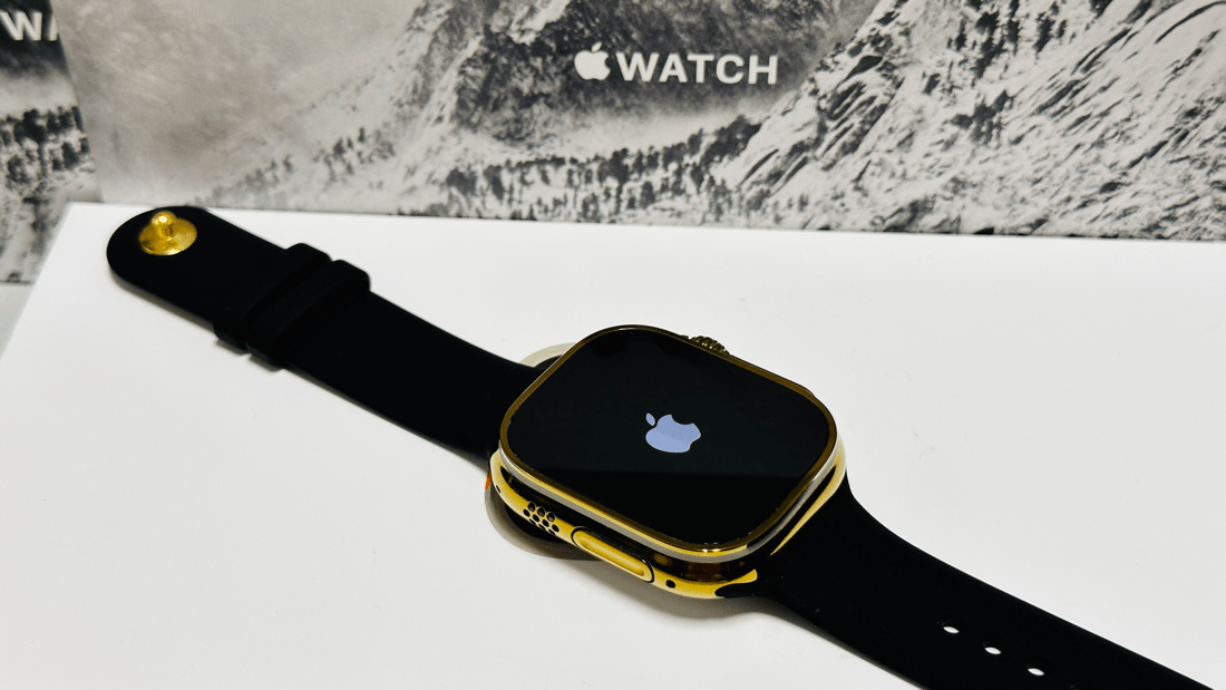 Custom diamond polished and anodized gold Apple Watch Ultra 2 49mm titanium with a Black Sport Band 24k Gold Pin