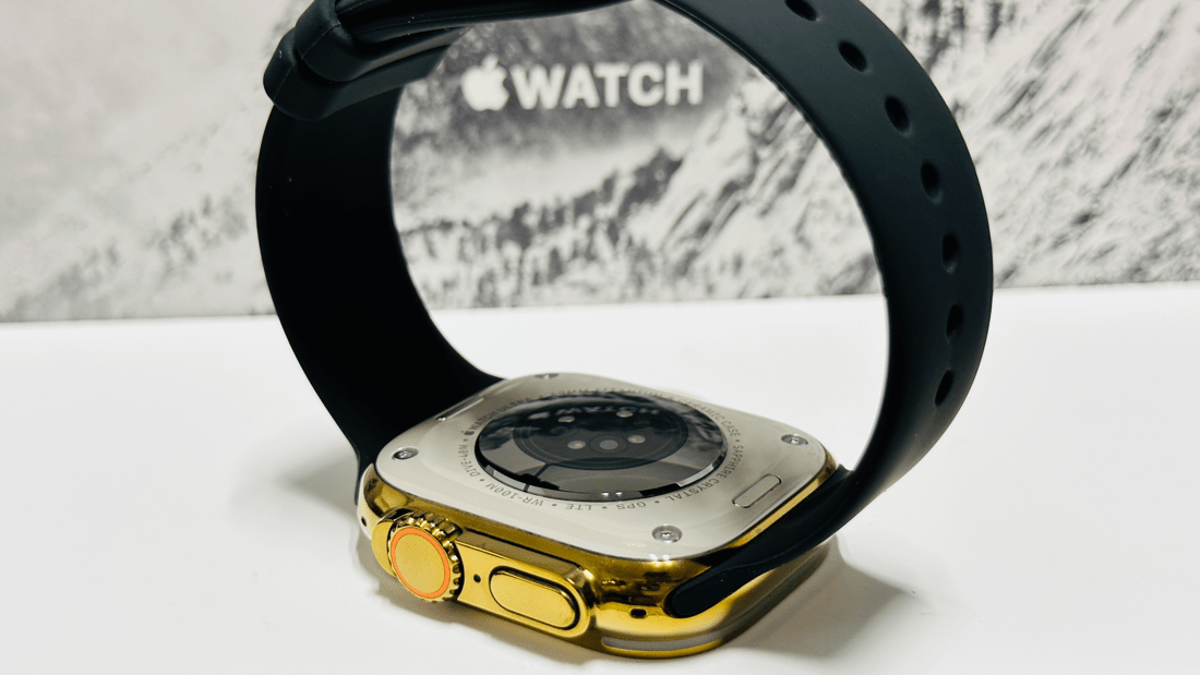 Custom diamond polished and anodized gold Apple Watch Ultra 2 49mm titanium with a Black Sport Band 24k Gold Pin