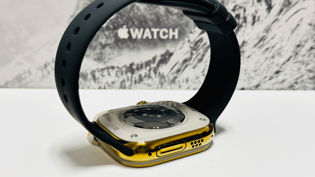 Custom diamond polished and anodized gold Apple Watch Ultra 2 49mm titanium with a Black Sport Band 24k Gold Pin