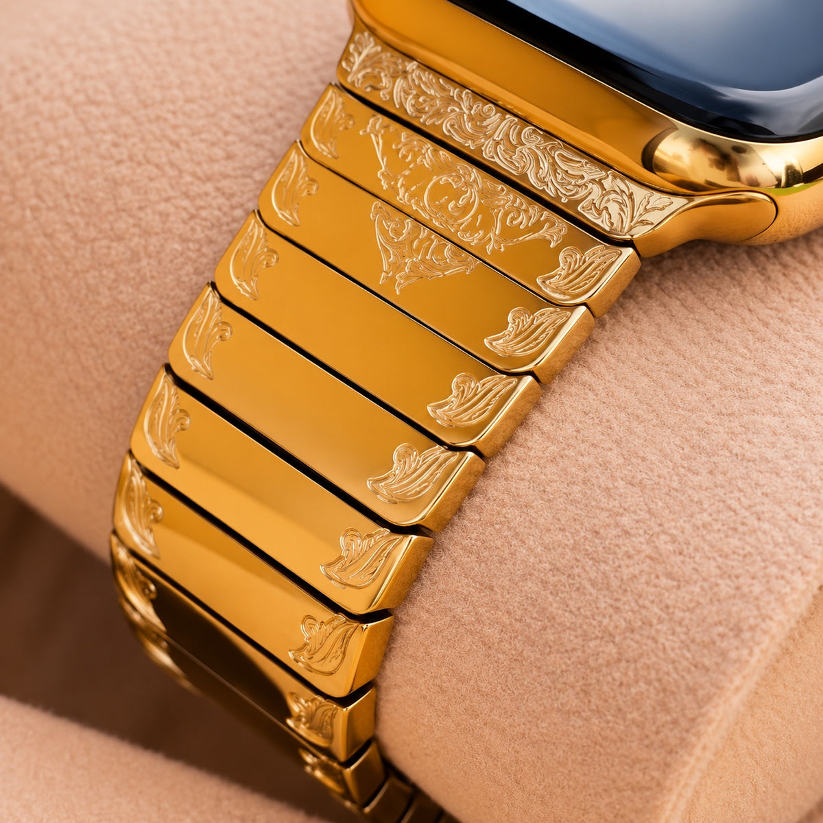 Detail of scroll engraving and polished links on 24K gold Apple Watch band